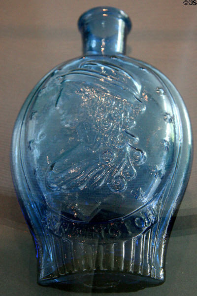 Mold blown glass flask with bust of Liberty (1826-35) from Kensington, PA at Toledo Glass Pavilion. Toledo, OH.