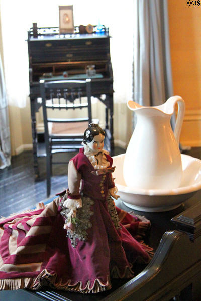 Doll, basin & pitcher with writing desk in Fanny Hayes bedroom at Hayes Presidential Home. Fremont, OH.