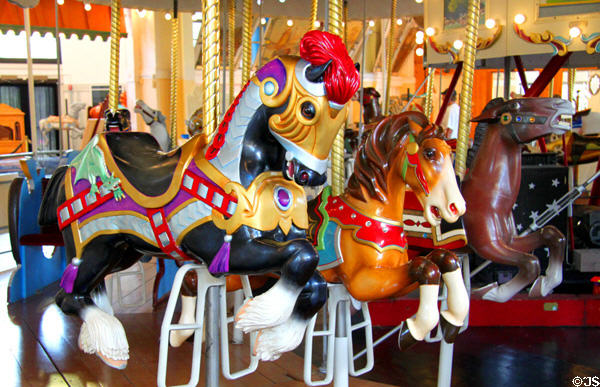 Three horses on Merry-Go-Round Museum's working carousel. Sandusky, OH.