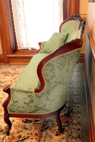 Green damask settee in parlor at Ida Saxton McKinley Historic House. Canton, OH.