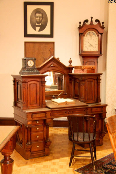Desk used by Congressman McKinley (c1880) in Canton & grandfather clock (c1790) that stood in first courthouse in Canton at William McKinley Presidential Museum & Library. Canton, OH.