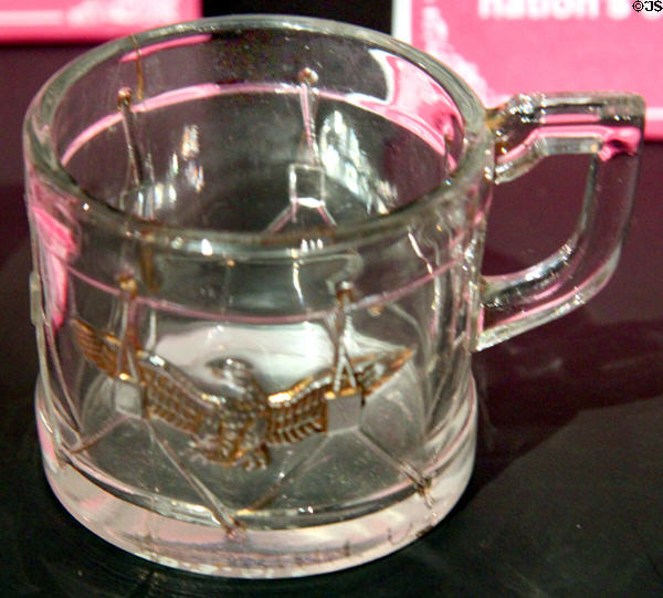 Commemorative glass mug in shape of drum with a gold eagle (1876) for U.S. Centennial Exhibition at McKinley Presidential Library & Museum. Canton, OH.