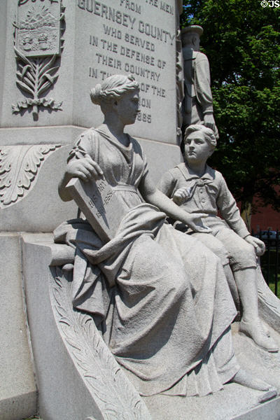 Mother teaching history to son figures on Cambridge Civil War Monument. Cambridge, OH.