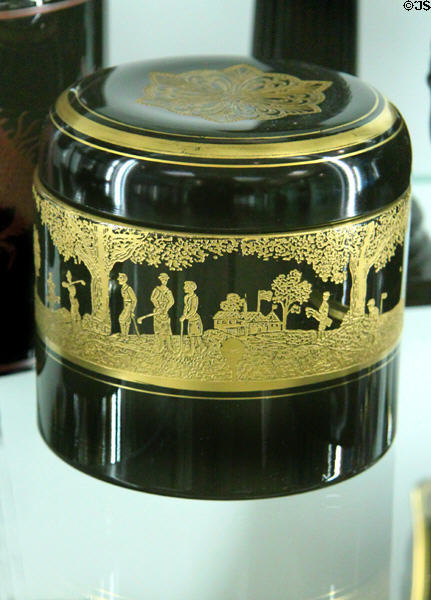 Ebony glass covered box with gold golf scene at National Museum of Cambridge Glass. Cambridge, OH.
