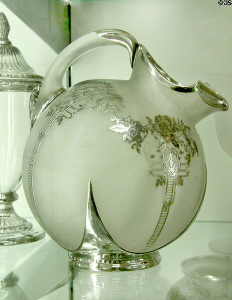 Opaque glass pitcher with silver decoration at National Museum of Cambridge Glass. Cambridge, OH.