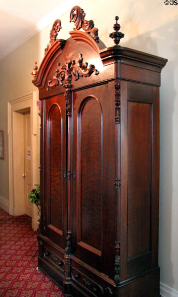 Cabinet with carved pediment at Kelton House Museum. Columbus, OH.