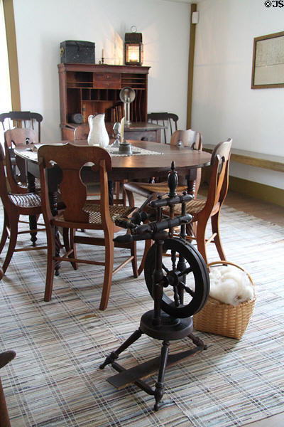 Parlor with table & spinning wheel above N.K. Whitney Store at Historic Kirtland Village. Kirtland, OH.