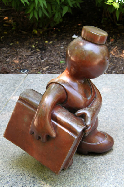Whimsical statuette of reader with book (1998) by Tom Otterness at Cleveland Public Library. Cleveland, OH.