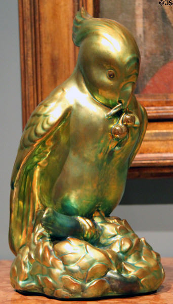 Earthenware greenish luster parrot (1910) by Zsolnay Factory of Hungary at Cleveland Museum of Art. Cleveland, OH.