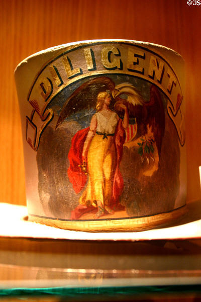 Diligent Fire Co. felt parade hat (c1791) with woman holding eagle at Harrisburg Fire Museum. Harrisburg, PA.