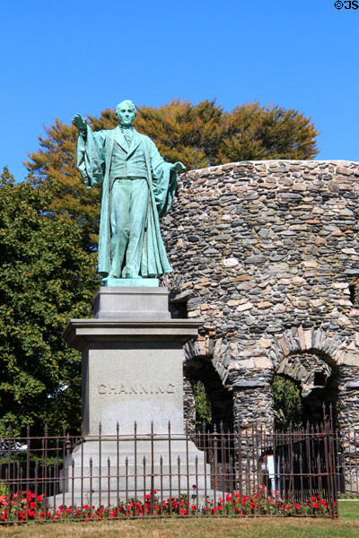 Statue of William Ellery Channing (1780-1842) a Unitarian preacher & Old Stone Mill (c1660) in Touro Park. Newport, RI.