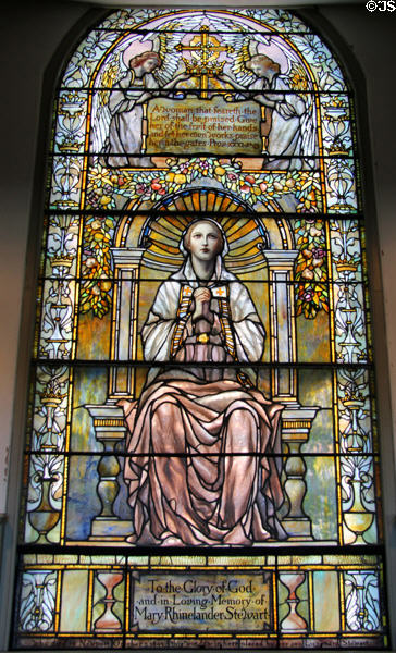 Stained glass window of praying woman commemorating Mary Rhinelander Stewart (1893) by Tiffany at Trinity Church. Newport, RI.