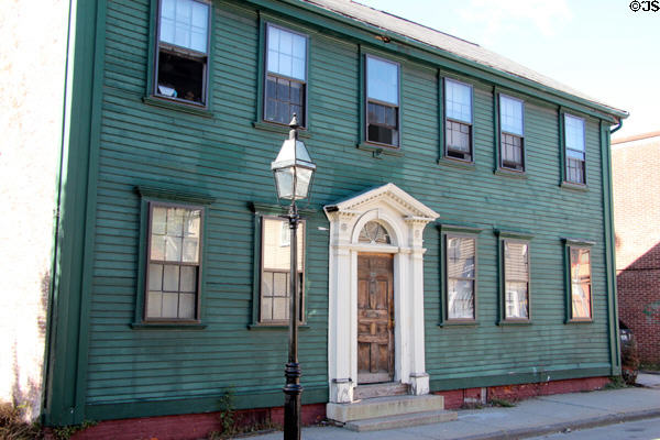 Green Federal style house with white front door surround (Spring St.). Newport, RI.