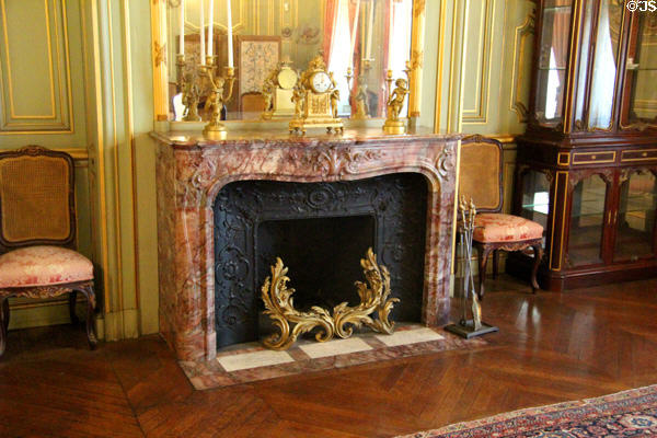 Breakfast Room mantelpiece of Paonazetto Italian marble with mantle clock at The Breakers. Newport, RI.