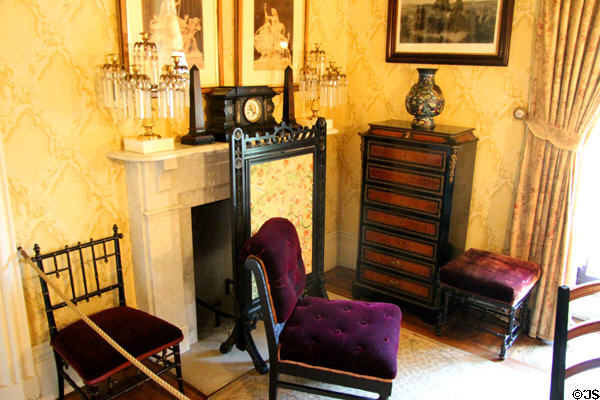 Bedroom fireplace with screen & chairs at Chateau-sur-Mer. Newport, RI.