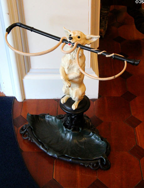Umbrella stand in shape of dog holding whip at Chepstow. Newport, RI.