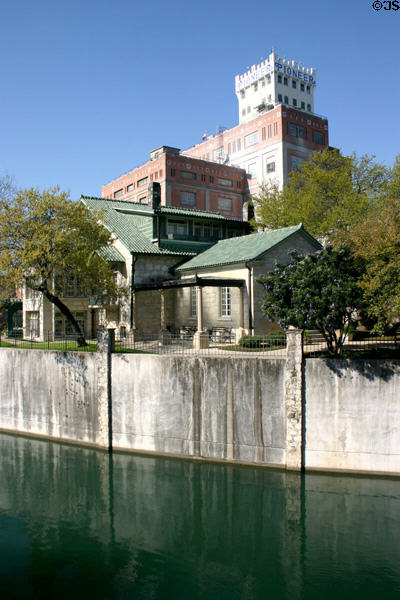Carl H. Guenther house (205 East Guenther) & Pioneer Flour Mills over San Antonio River. San Antonio, TX.