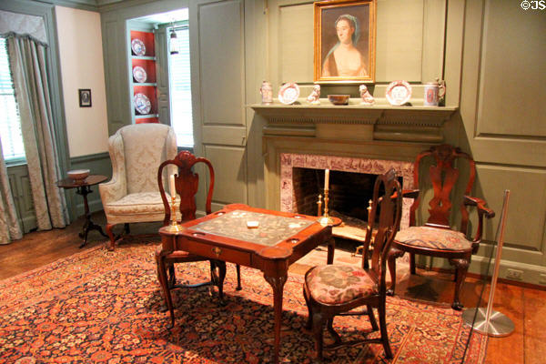 Card table with embroidered top & fireplace (18thC) with portrait by John Singleton Copley in Queen Anne Suite at Bayou Bend. Houston, TX.