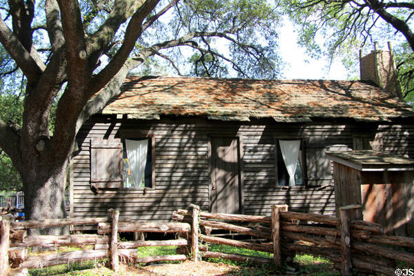 Old Place (1828) historic cabin at Sam Houston Park open air village. Houston, TX.