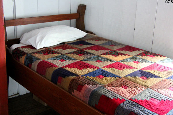 Bed with quilt at Nichols-Rice-Cherry House at Sam Houston Park. Houston, TX.