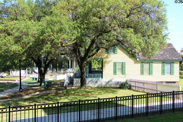 View of Sam Houston Park open air museum grounds with San Felipe Cottage. Houston, TX.
