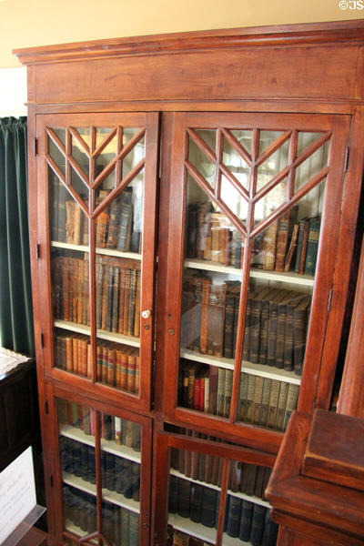 Bookcase in Staiti House at Sam Houston Park. Houston, TX.