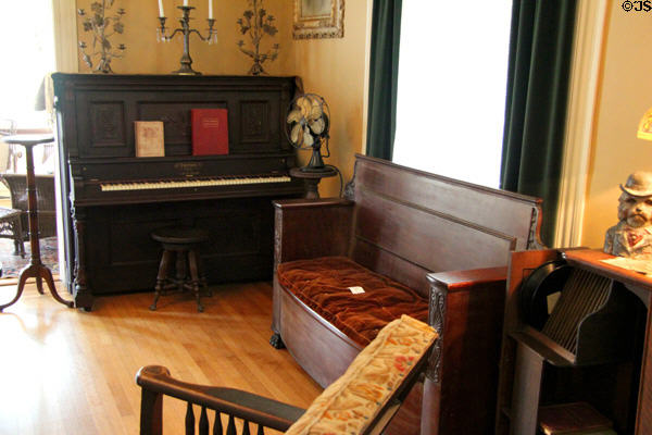 Piano & settee in Staiti House at Sam Houston Park. Houston, TX.