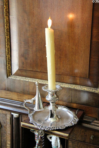 Silver candlestick on pull-on candle shelf of bureau cabinet (c1750) at Rienzi house museum. Houston, TX.
