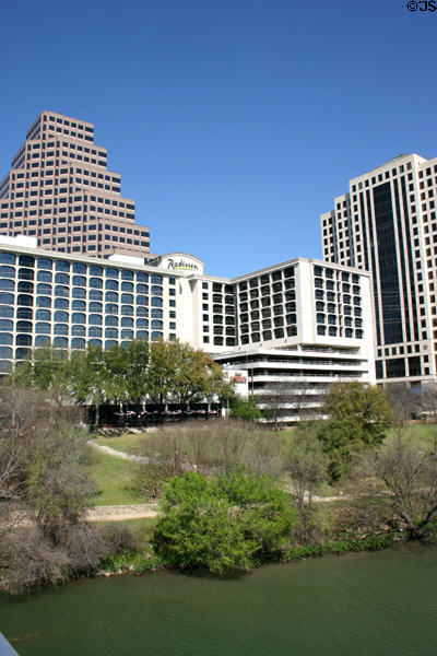 San Jacinto Center (1987) (21 floors) (98 San Jacinto Boulevard) to right of Radisson Hotel above Colorado River. Austin, TX. Architect: Page Southerland Page.