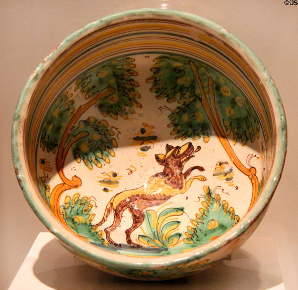 Earthenware bowl painted with jumping canine (late 17th C) from Spain at San Antonio Museum of Art. San Antonio, TX.