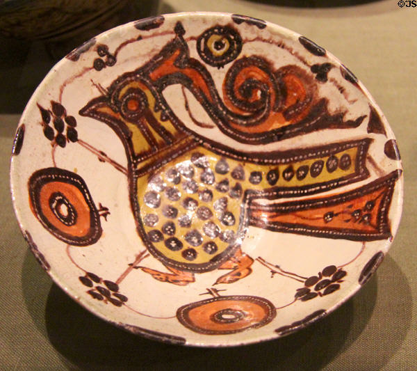 Earthenware bowl depicting bird & flowers (11th C) from Iran at San Antonio Museum of Art. San Antonio, TX.