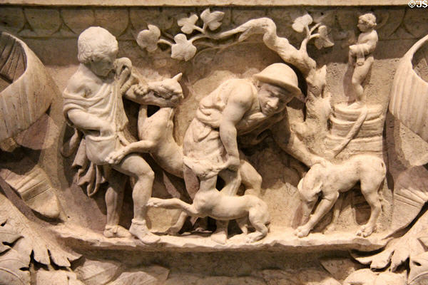 Roman marble garland sarcophagus with carved detail of Romans with dogs (c130-150 CE) at San Antonio Museum of Art. San Antonio, TX.