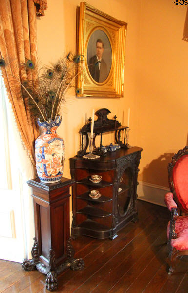 Vase with stand & display case in formal parlor at Edward Steves Homestead Museum. San Antonio, TX.