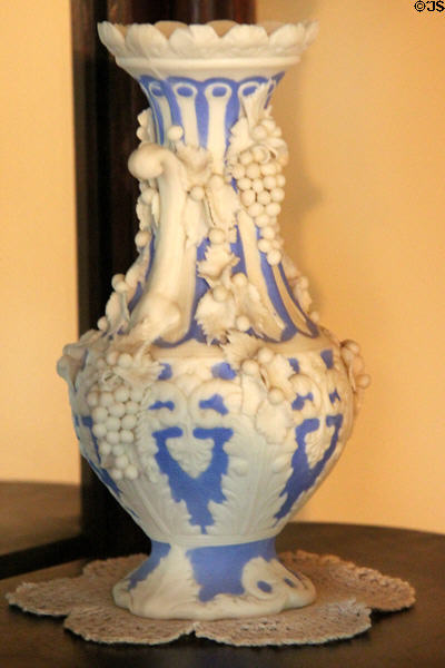 White on blue bisque vase with grapes at Edward Steves Homestead Museum. San Antonio, TX.