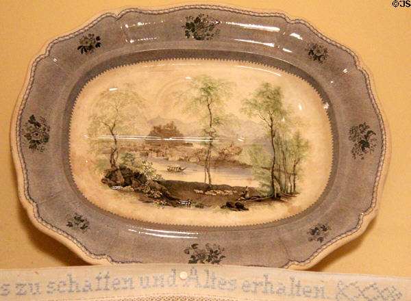Transfer print platter over embroidered German saying at Edward Steves Homestead Museum. San Antonio, TX.
