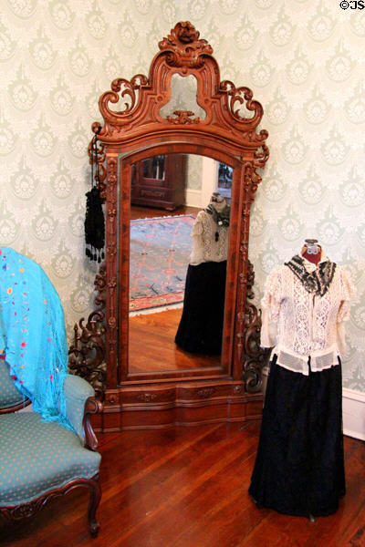 Mirror in carved frame at Edward Steves Homestead Museum. San Antonio, TX.