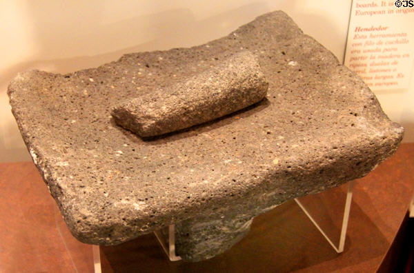 Corn grinding stone in museum at Mission San José. San Antonio, TX.
