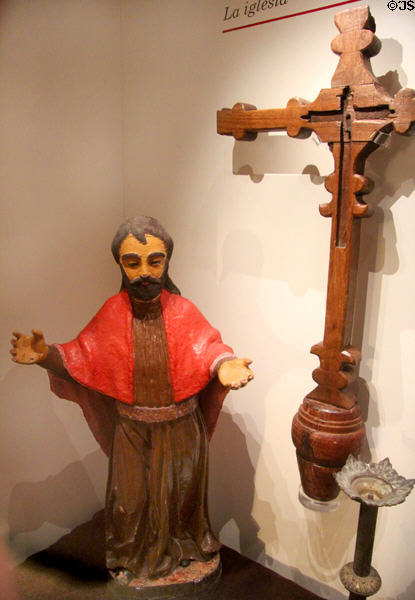 Spanish statue of St Joseph & carved cross in museum at Mission San José. San Antonio, TX.