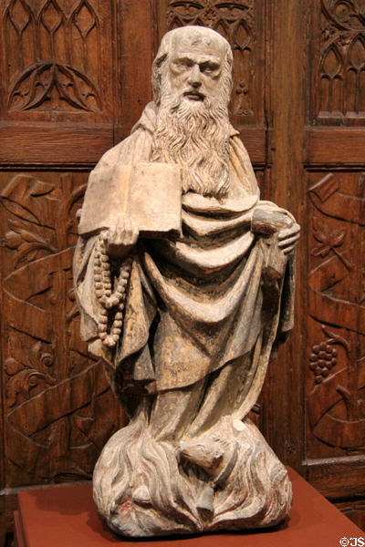St Anthony Abbot & hog symbol limestone sculpture (late 1400s) from Burgundy, France at McNay Art Museum. San Antonio, TX.