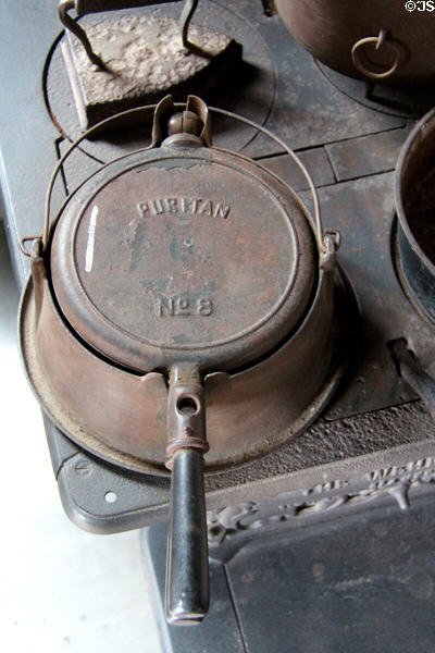 Puritan waffle iron atop stove in Walton-Smith log cabin at Pioneer Museum. Fredericksburg, TX.