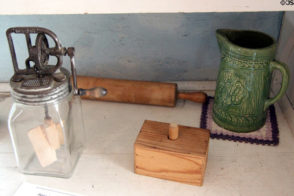 Butter churn, mold & ceramic pitcher in Fassel-Roeder House at Pioneer Museum. Fredericksburg, TX.