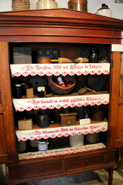 Shelving unit with embroidered German sayings in Kammlah kitchen at Pioneer Museum. Fredericksburg, TX.