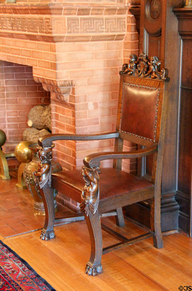 Fireplace arm chair in central hall at McFaddin-Ward House. Beaumont, TX.