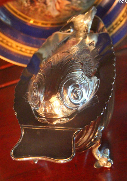 Silver serving dish in shape of fish in dining room at McFaddin-Ward House. Beaumont, TX.
