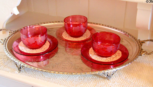 Ruby glass dessert bowls in pantry at McFaddin-Ward House. Beaumont, TX.