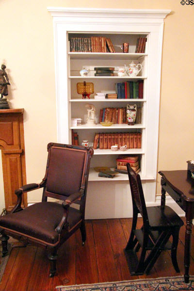Bookcase with Ben Franklin library chair convertible to step ladder at Earle-Napier-Kinnard House. Waco, TX.
