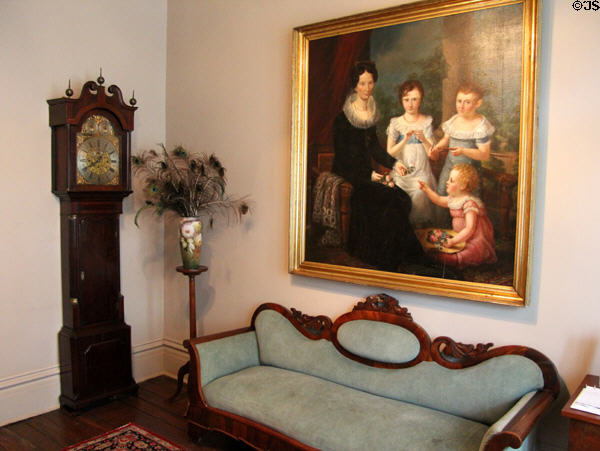 Entry hall with tall clock, settee & historic painting at McCulloch House. Waco, TX.