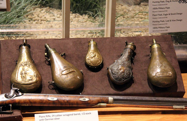 Metal powder flask collection (early 1800s) at Texas Ranger Hall of Fame and Museum. Waco, TX.
