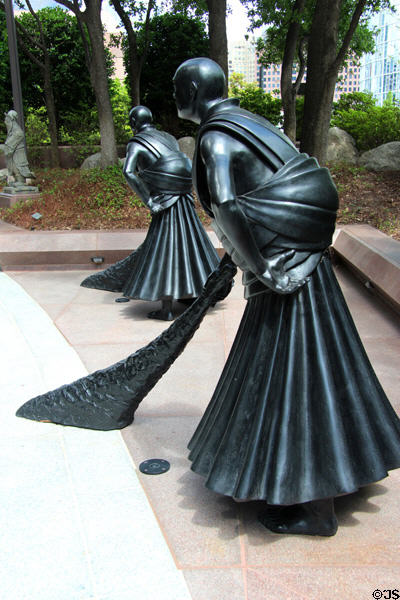 Sweepers bronze sculpture (2012) by Wang Shugang of China at Trammell Crow Center, part of Crow Collection of Asian Art. Dallas, TX.