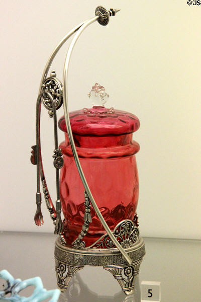 Blown glass pickle jar on silver plated stand with tongs (c1885) by James W. Tufts Co., Boston, MA at Dallas Museum of Art. Dallas, TX.